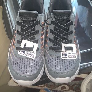 Skechers Kids' Charcoal and Tangerine Sneakers.